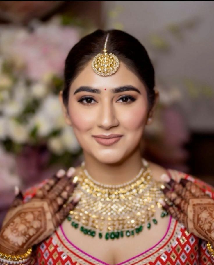 Makeup Artist creating a fresh seasonal makeup look for summer glow